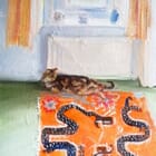 Cat on a Chinese mat