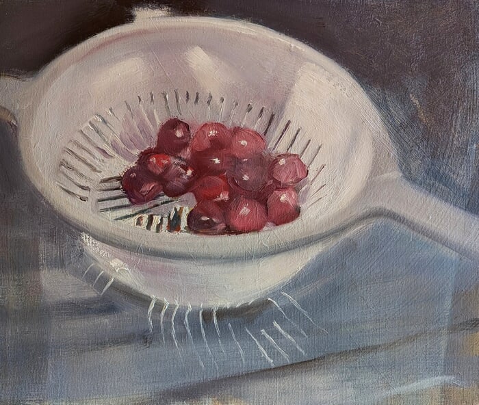 Cherries in a plastic colander von Rosemary Burn